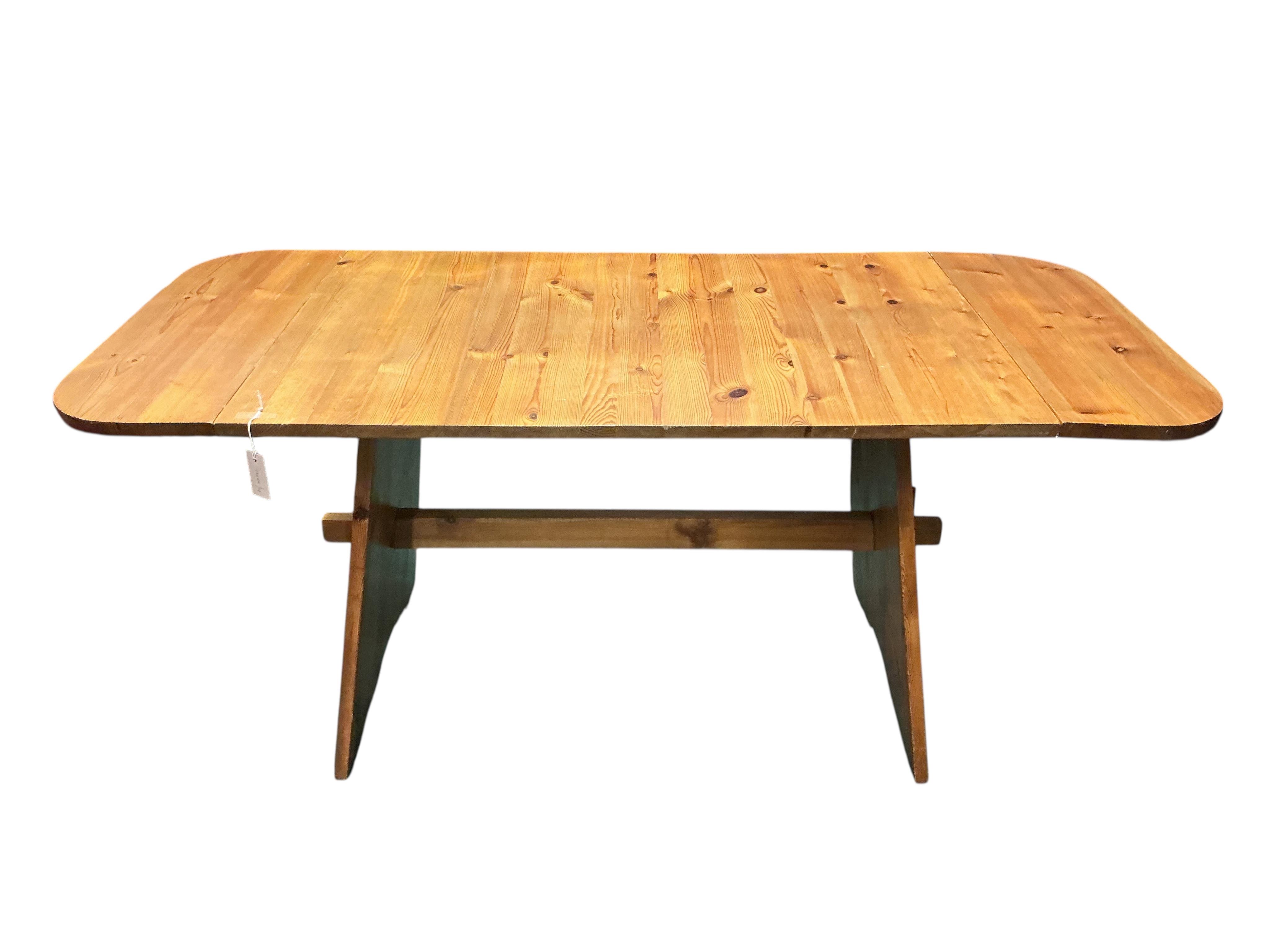 A Spanish style pine drop flap dining table, width 120cm, depth 78cm, height 75cm